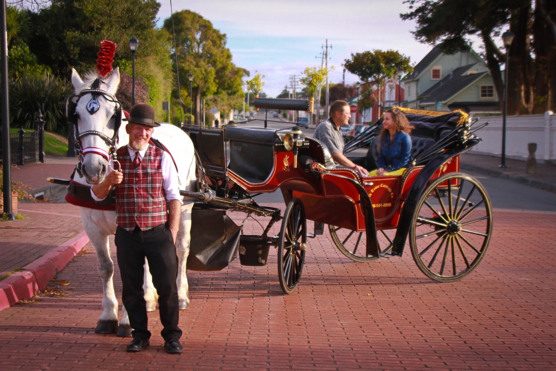 Brendan Fearon with the horse, carriage, and riders for Old Town Carriage Co. in Eureka California